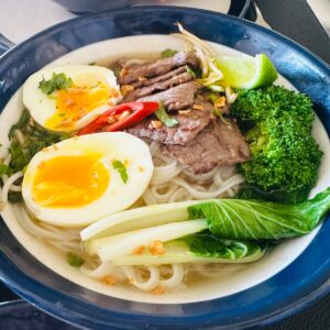 Vietnamese Pho Noodle Soup with Flat Rice Noodles, Beef and Fresh Herbs